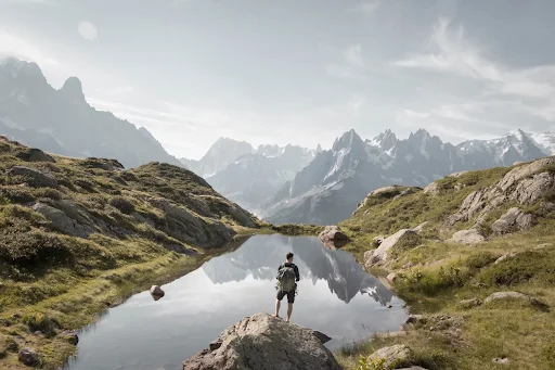 Person standing on rock mountain