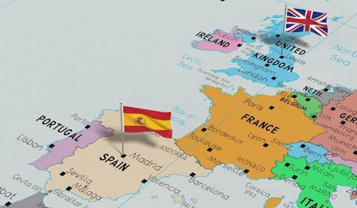 United Kingdom and Spain pin flags on political map 3D illustration
