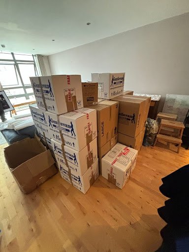 assorted boxes and furniture ready for removals